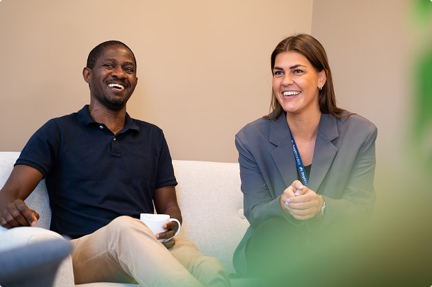 2 people sitting in a couch.